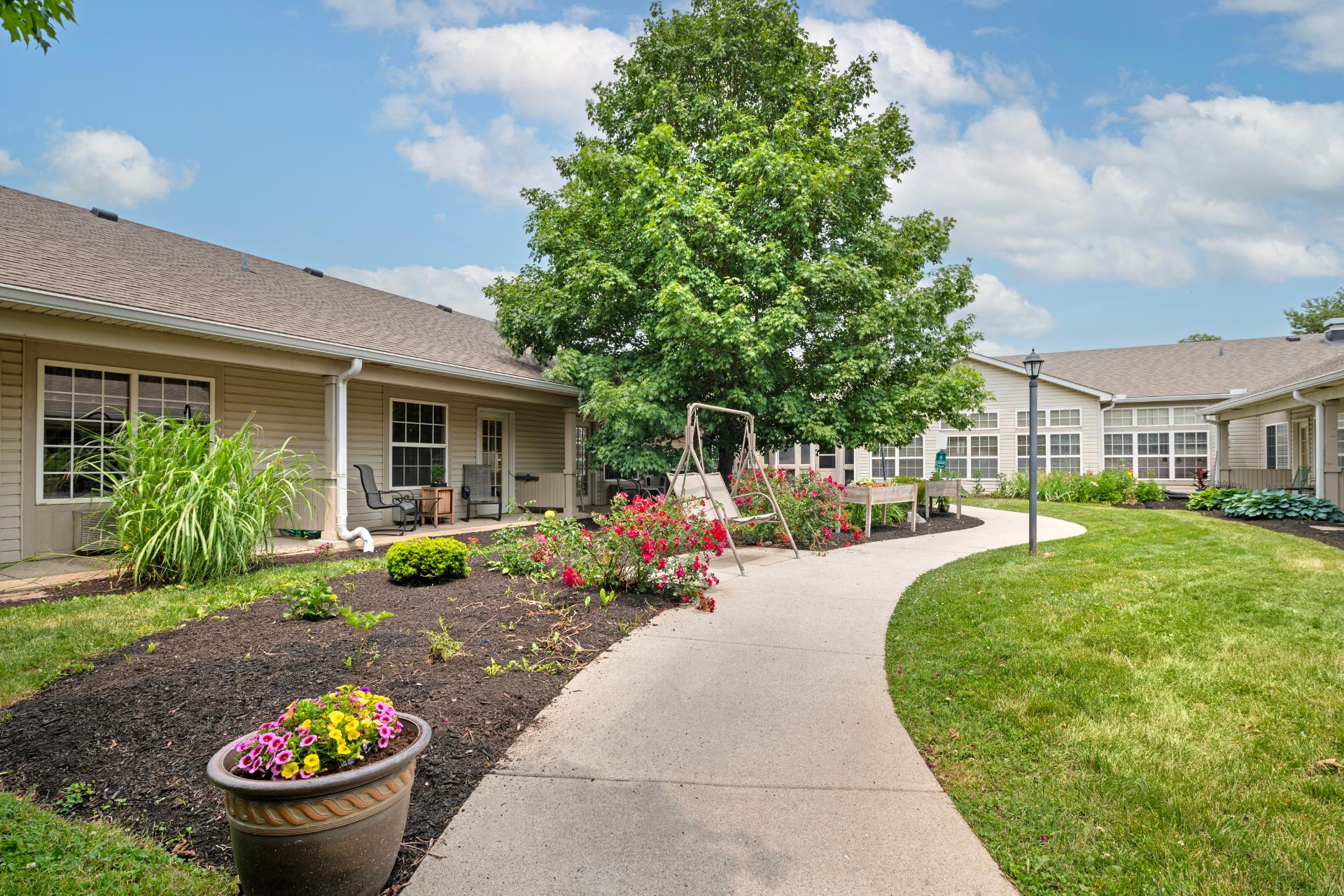 CV_richmond_walkway_web exterior garden area with gazebo seating and fountain